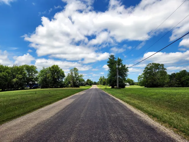 a view of a garden with a building in the background