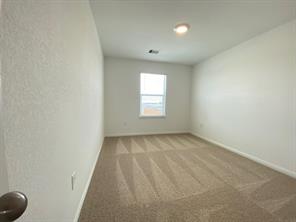 213 Saide Street Georgetown, TX 78626 - Photo 27 of 32 Carpeted interior room featuring a single window and recessed lighting