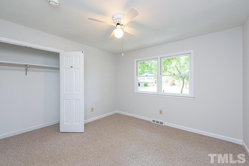 509 Compton Road Raleigh, NC 27609 - Photo 17 of 30 Bedroom 3 with ceiling fan and double window.