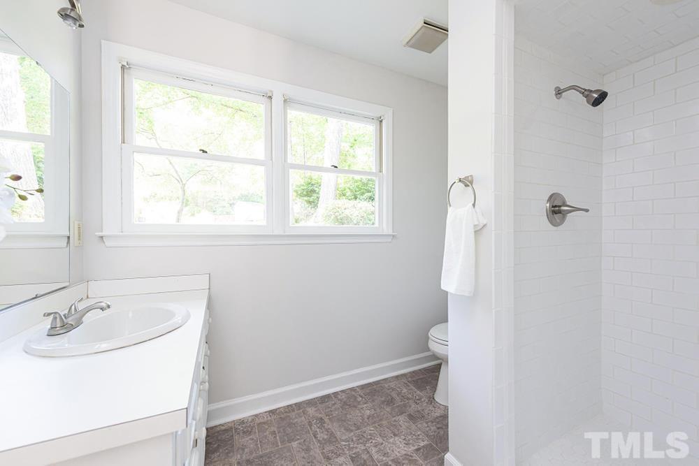 509 Compton Road Raleigh, NC 27609 - Photo 22 of 30 Full bath on lower level with walk in shower.