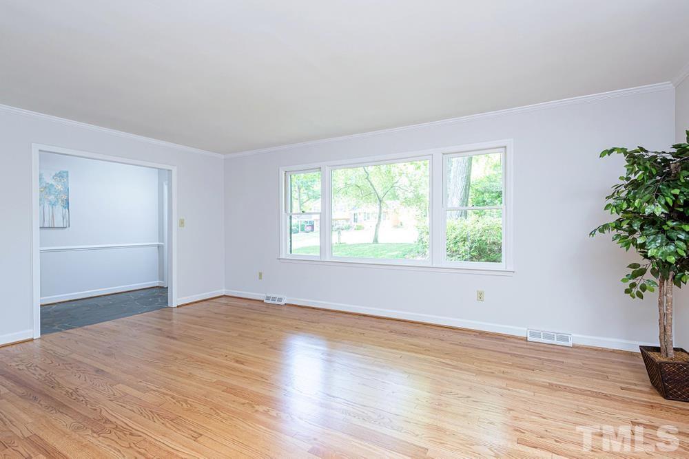 509 Compton Road Raleigh, NC 27609 - Photo 4 of 30 Lots of natural light during the day. Fresh paint through out the home.