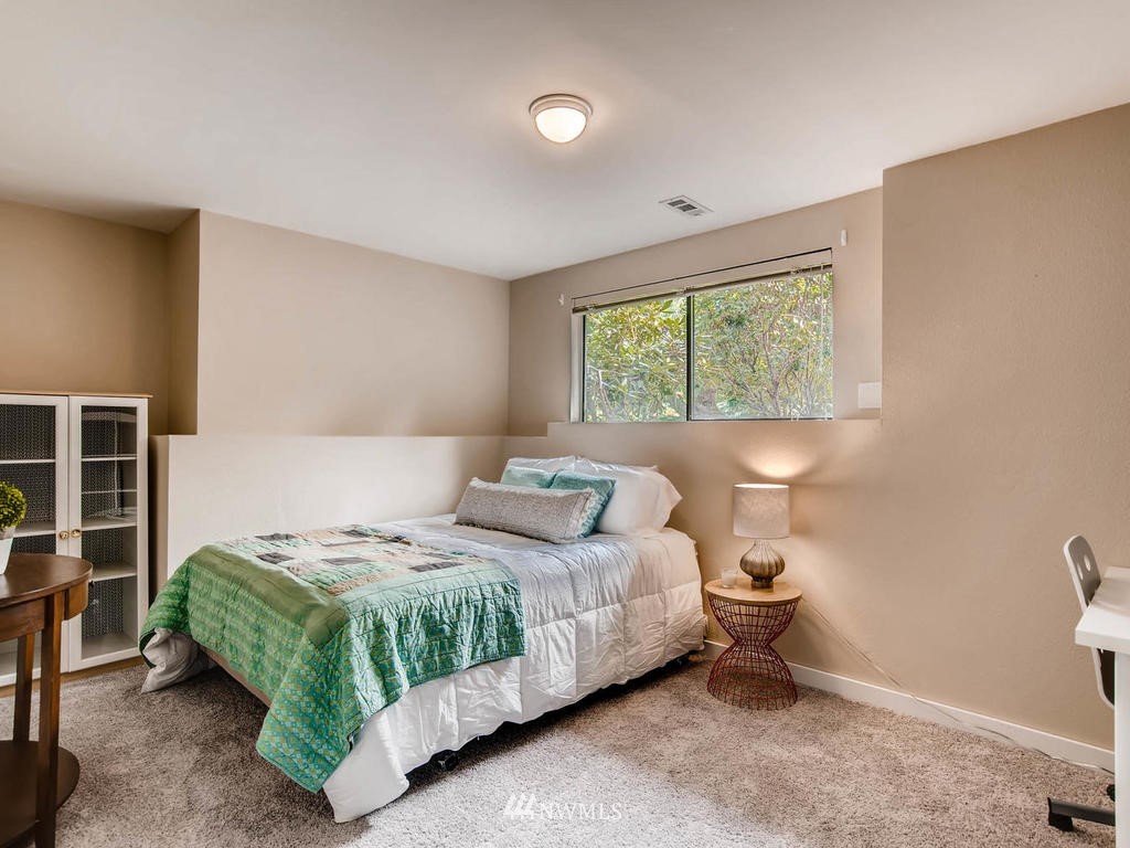22108 1st Place West Bothell, WA 98021 - Photo 22 of 25 a bedroom with a bed and a window