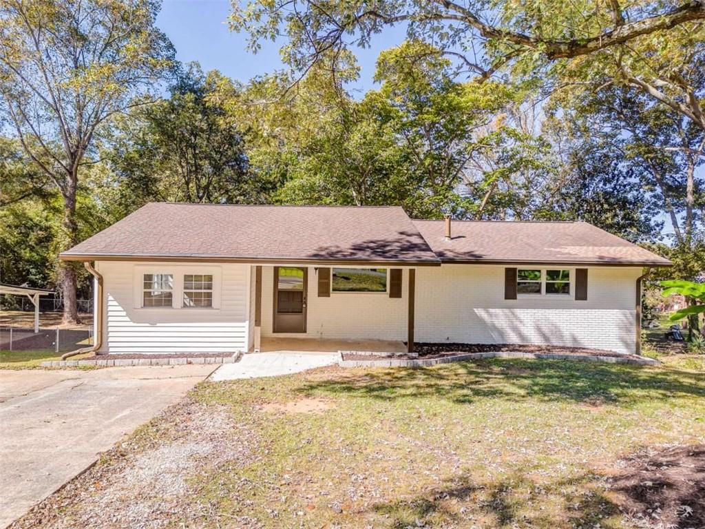 front view of a house with a yard
