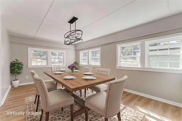 a view of a dining room with furniture window and outside view