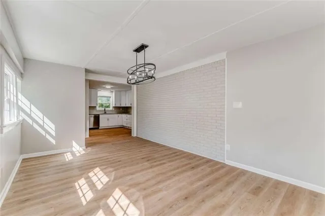 a bedroom with a bed couch and a potted plant