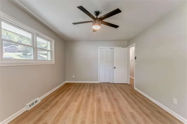 a bedroom with bed and a couch