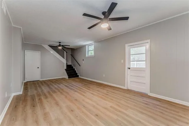 a view of an empty room with a window