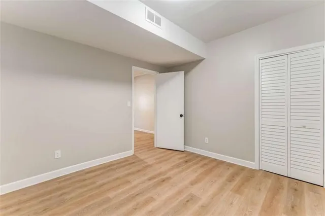 a bedroom with a bed and a table in it