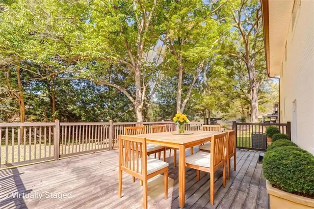 a view of a house with wooden deck