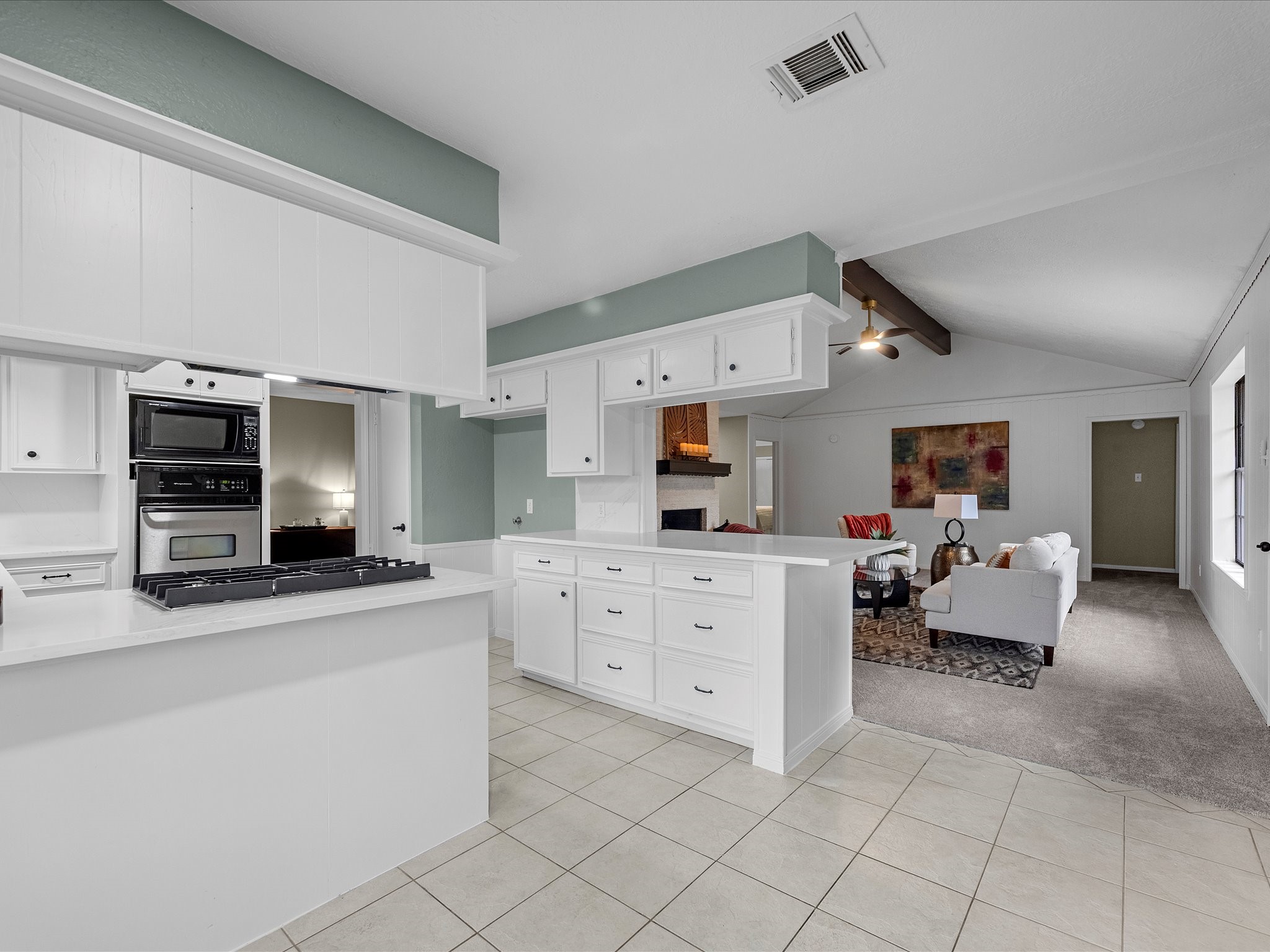 4002 Cujanes Street Pasadena, TX 77504 - Photo 12 of 26 a kitchen with cabinets and chairs
