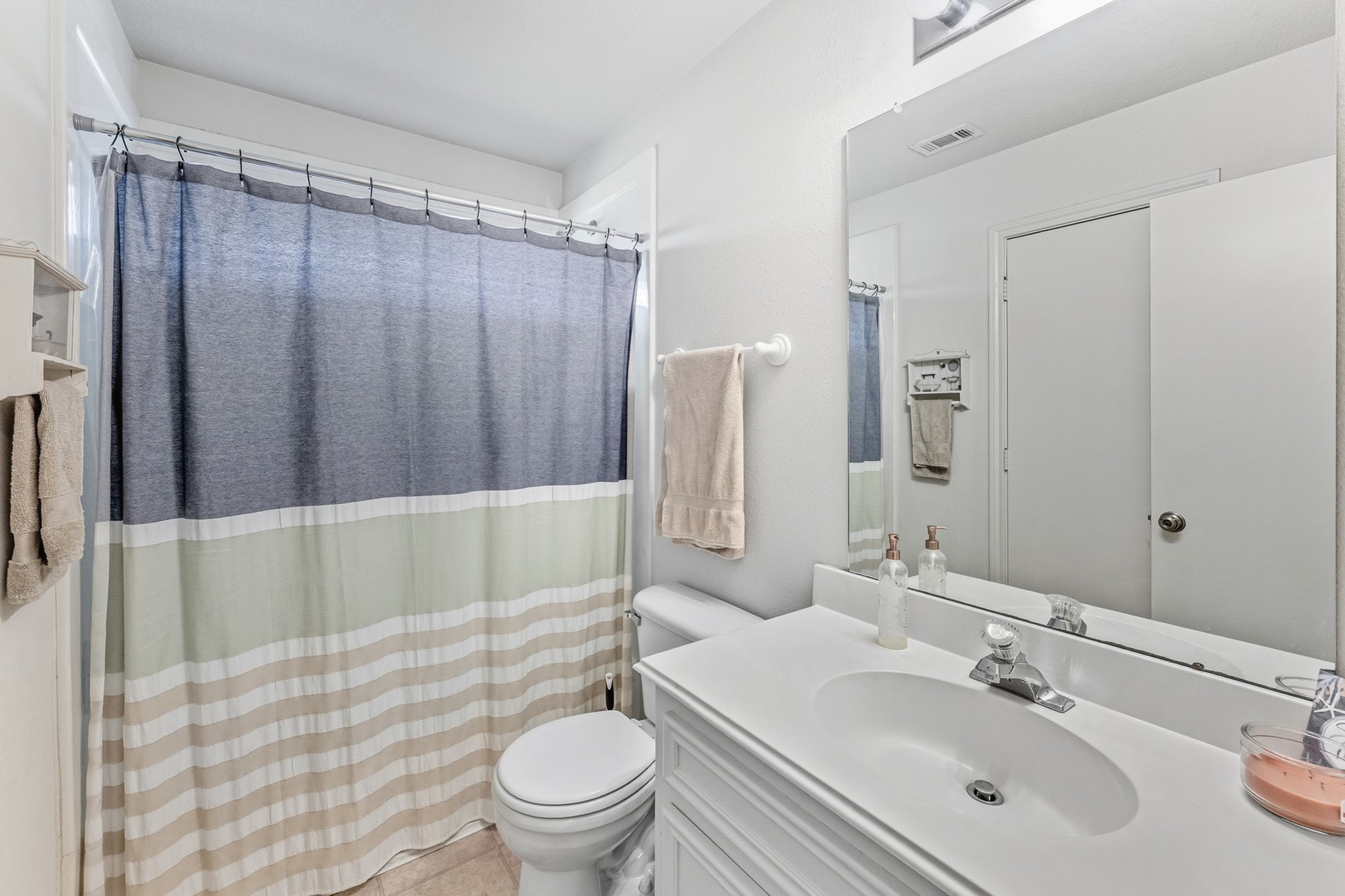 691 Bishop Road Huntsville, TX 77320 - Photo 21 of 32 a bathroom with a sink toilet and shower