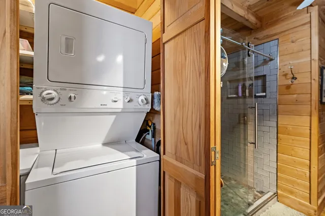 a close view of a utility room with dryer and washer