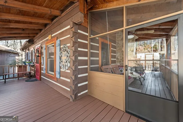 a view of a porch with wooden floor
