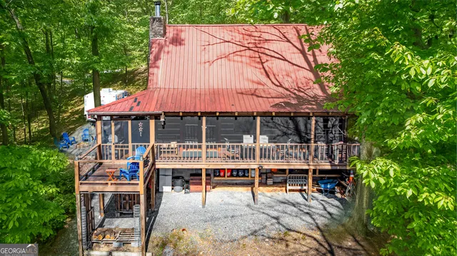 a view of a wooden fence with a bench in a garden