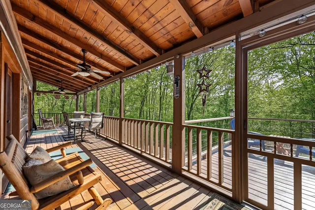 a view of balcony with couch and chairs