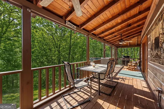a view of a two chairs in the balcony