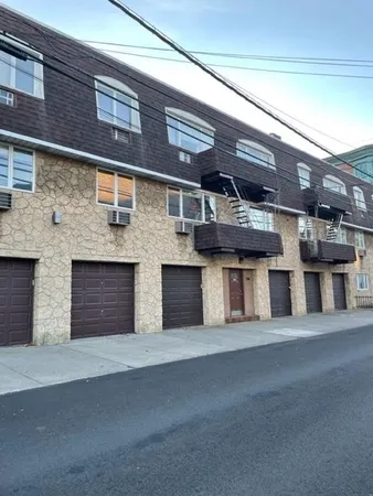 a large building with a parking space