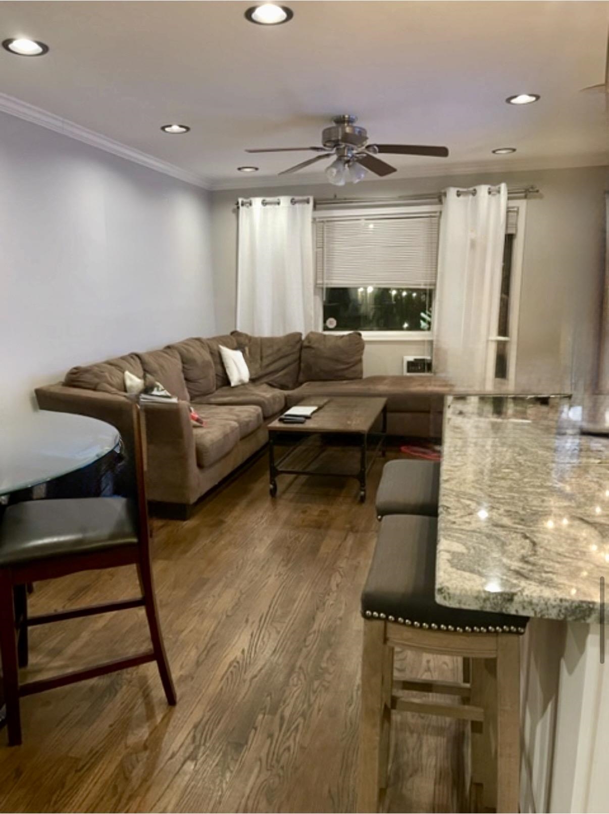 533 Madison Street, Unit 3A Hoboken, NJ 07030 - Photo 5 of 11 a living room with furniture and a large window