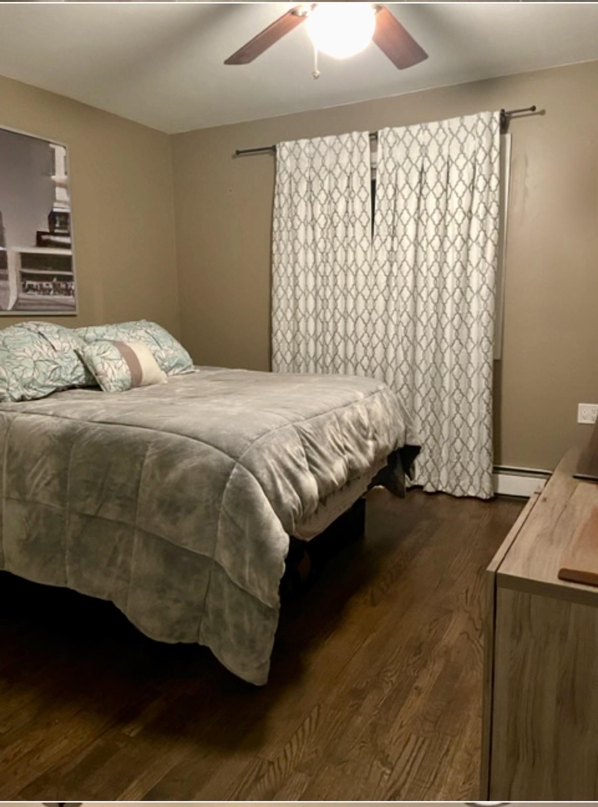 533 Madison Street, Unit 3A Hoboken, NJ 07030 - Photo 6 of 11 a bedroom with a bed and a window