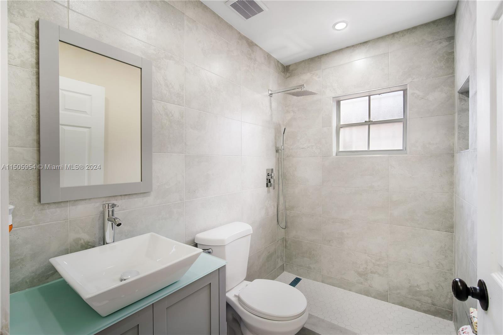 14364 Southwest 159th Terrace Miami, FL 33177 - Photo 15 of 32 a bathroom with a sink a toilet and shower