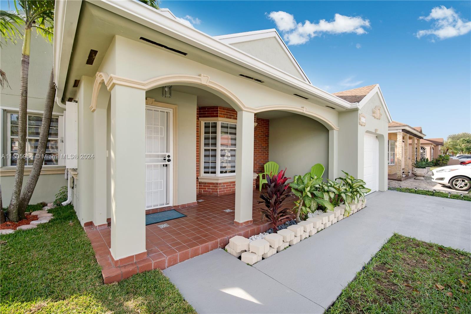 14364 Southwest 159th Terrace Miami, FL 33177 - Photo 2 of 32 a front view of a house with yard