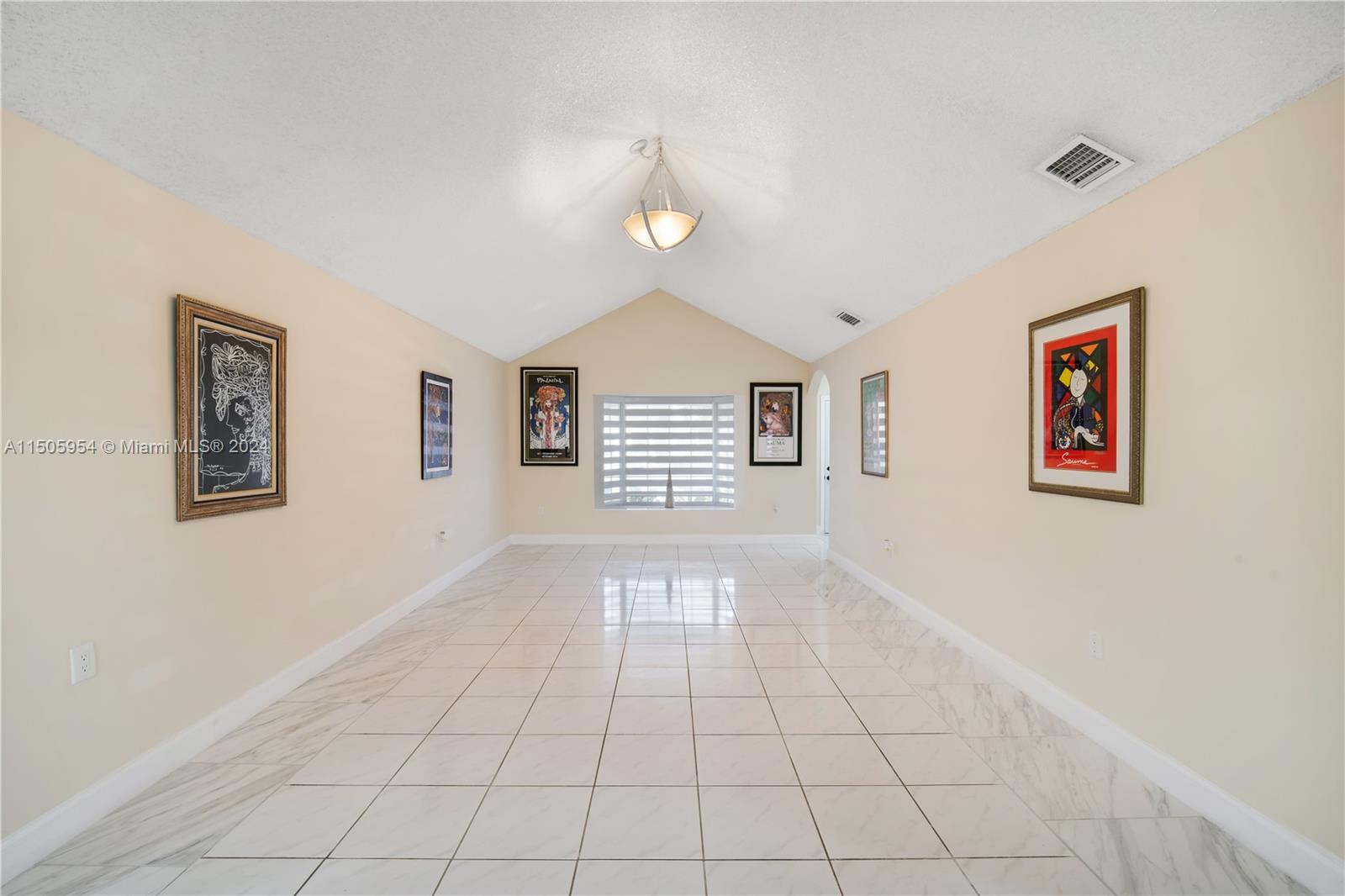 14364 Southwest 159th Terrace Miami, FL 33177 - Photo 4 of 32 a view of an empty room with a window