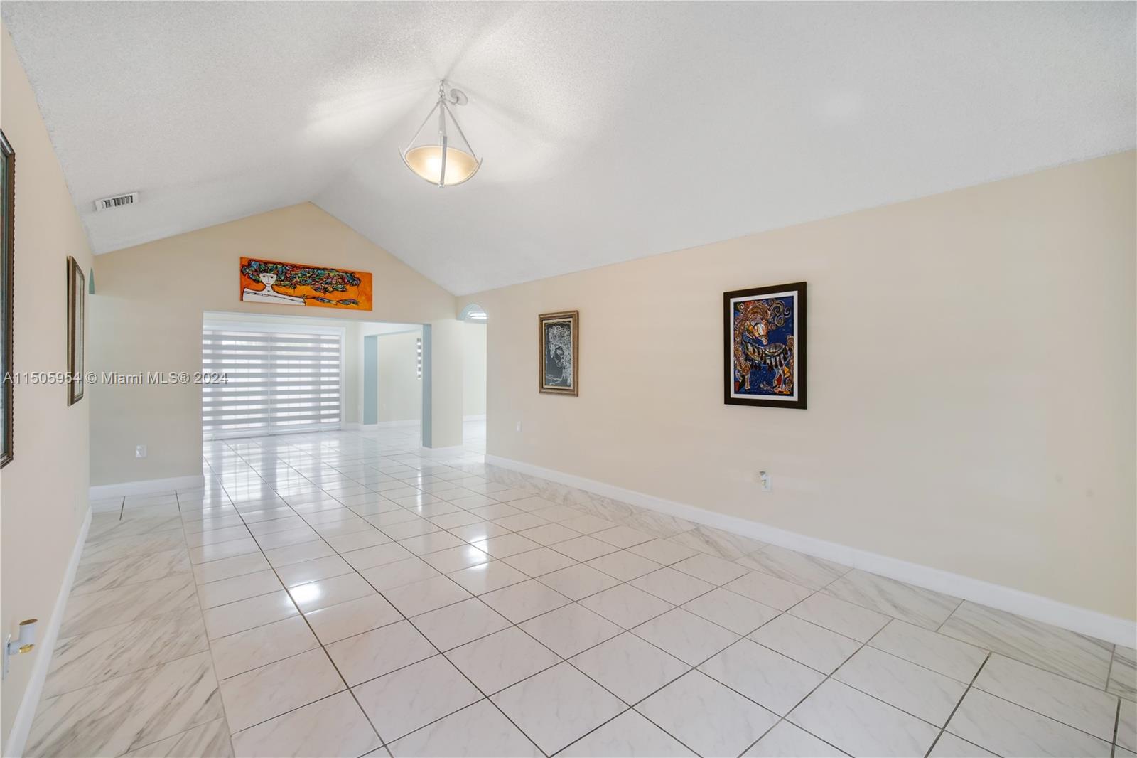 14364 Southwest 159th Terrace Miami, FL 33177 - Photo 5 of 32 a view of an empty room and window