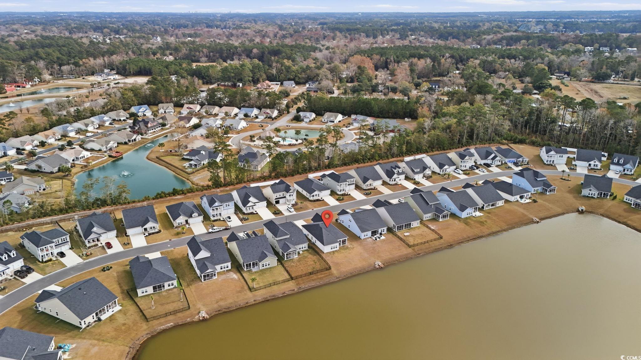 176 Empyrean Circle Myrtle Beach, SC 29588 - Photo 33 of 36 Aerial view of property and surrounding area with a large body of water and nearby suburban area