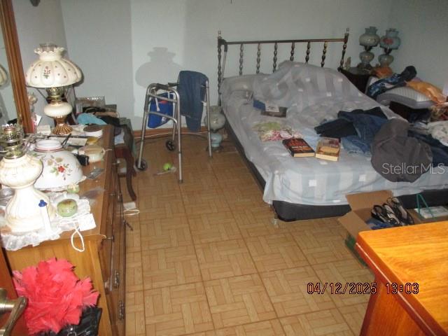 17849 Morninghigh Drive Lutz, FL 33549 - Photo 14 of 15 a living room with furniture and a chandelier