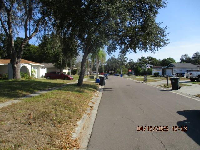 17849 Morninghigh Drive Lutz, FL 33549 - Photo 2 of 15 a view of a street with houses