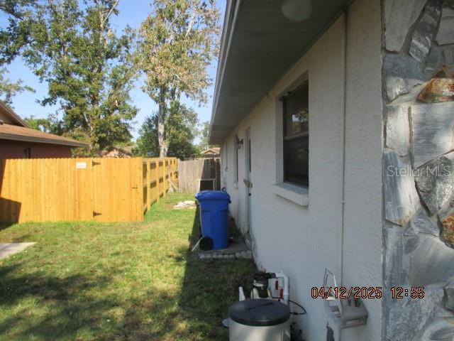 17849 Morninghigh Drive Lutz, FL 33549 - Photo 6 of 15 a backyard of a house with lots of green space and plants