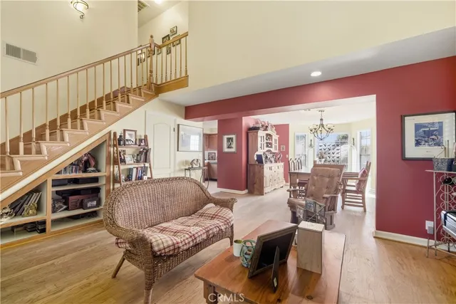 a living room with furniture or stairs and a wooden floor