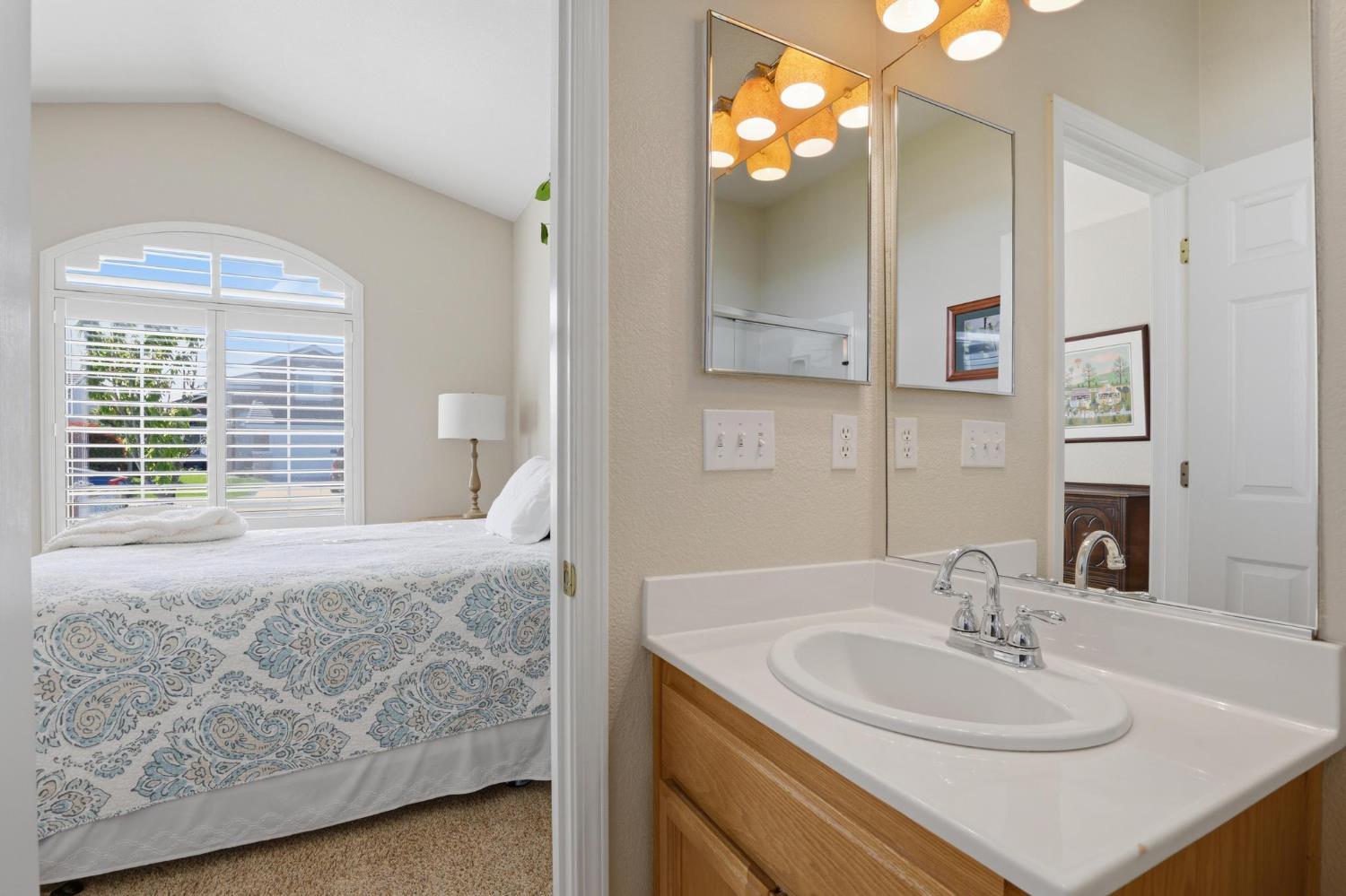 502 Waterfowl Way Williams, CA 95987 - Photo 13 of 51 a bathroom with a sink and a mirror
