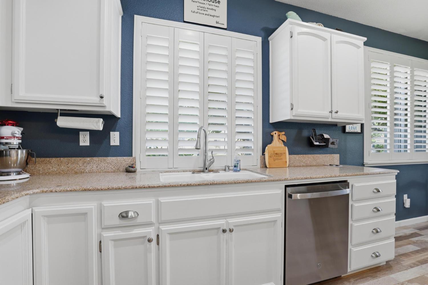 502 Waterfowl Way Williams, CA 95987 - Photo 19 of 51 a kitchen with granite countertop a sink and a stove