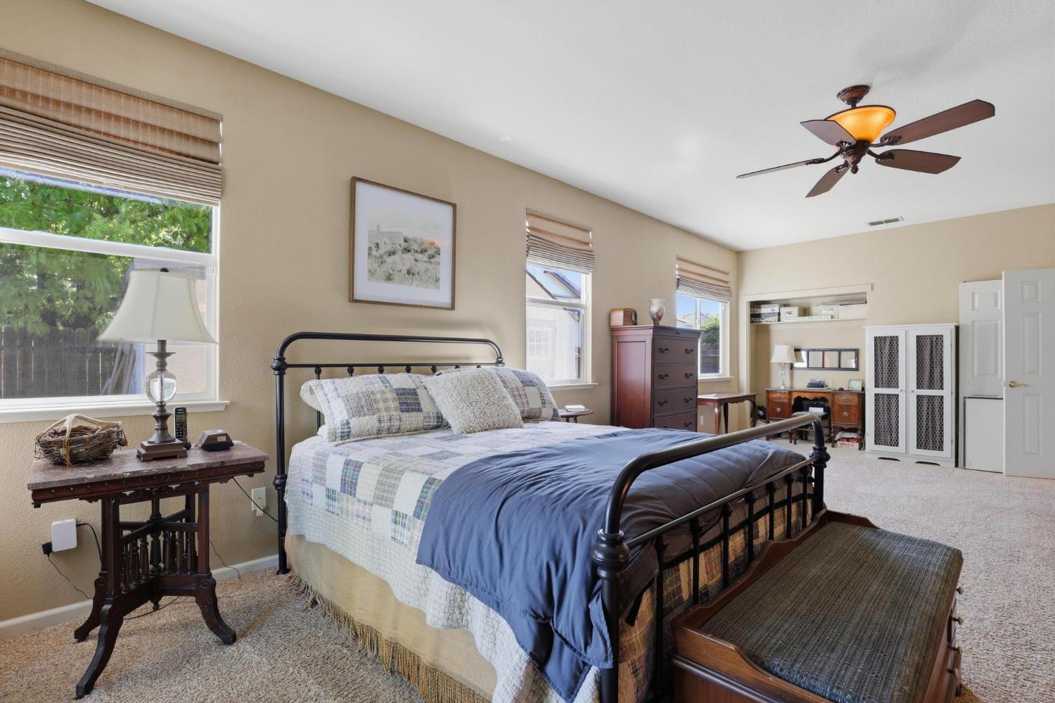 502 Waterfowl Way Williams, CA 95987 - Photo 25 of 51 a bedroom with a bed and a chandelier