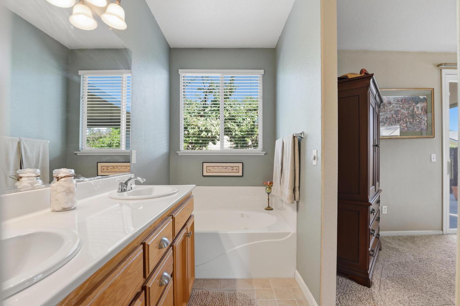 502 Waterfowl Way Williams, CA 95987 - Photo 27 of 51 a bathroom with a tub sink and mirror