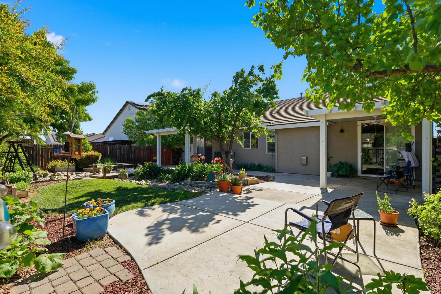 502 Waterfowl Way Williams, CA 95987 - Photo 36 of 51 a view of a house with backyard sitting area and garden