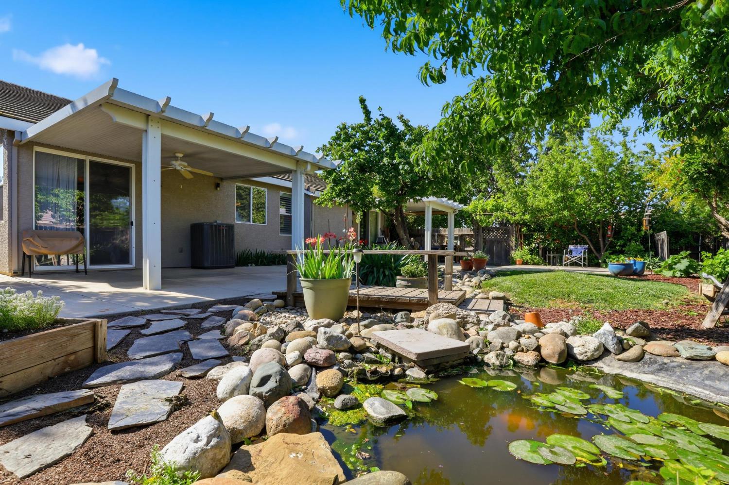 502 Waterfowl Way Williams, CA 95987 - Photo 4 of 51 a view of a house with backyard sitting area and swimming pool