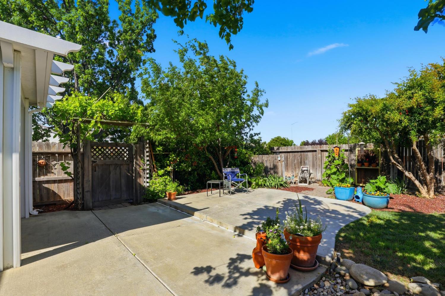 502 Waterfowl Way Williams, CA 95987 - Photo 47 of 51 a patio with table and chairs and potted plants