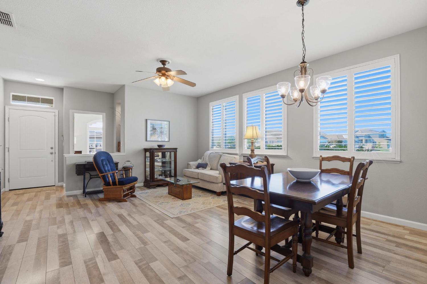 502 Waterfowl Way Williams, CA 95987 - Photo 8 of 51 a living room with furniture a window and a chandelier