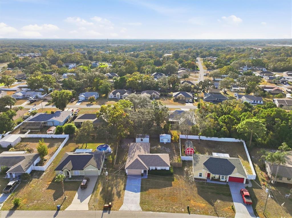 7172 Toledo Road Spring Hill, FL 34606 - Photo 17 of 38 an aerial view of residential houses with outdoor space