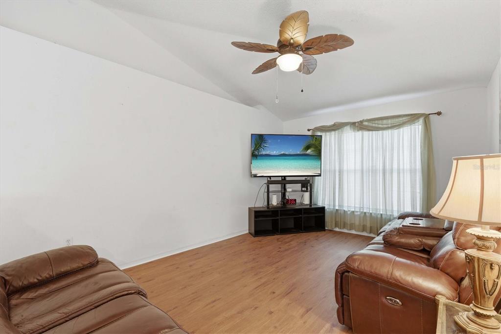 7172 Toledo Road Spring Hill, FL 34606 - Photo 24 of 38 a bedroom with bed and window