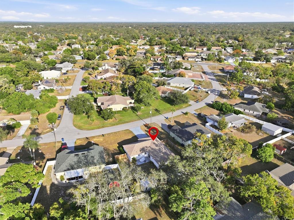 7172 Toledo Road Spring Hill, FL 34606 - Photo 32 of 38 an aerial view of residential houses with outdoor space