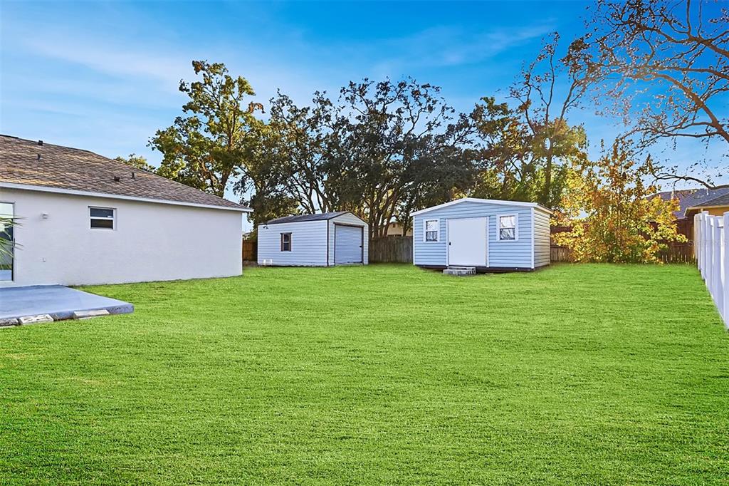 7172 Toledo Road Spring Hill, FL 34606 - Photo 38 of 38 a front view of a house with garden