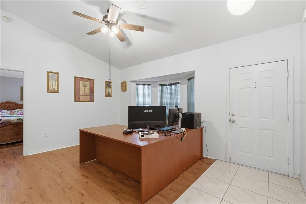 7172 Toledo Road Spring Hill, FL 34606 - Photo 4 of 38 a view of workspace with wooden floor