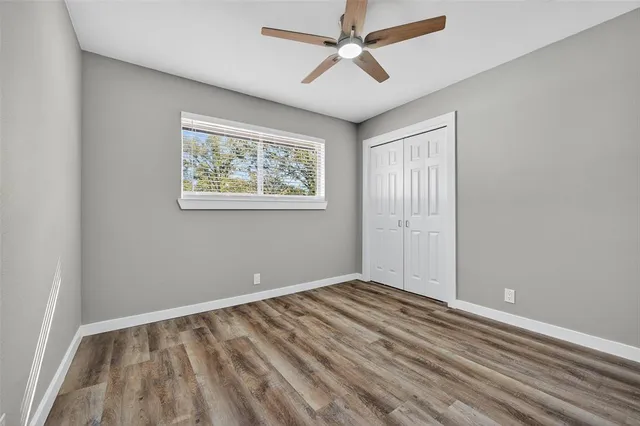 a view of room with window and ceiling fan