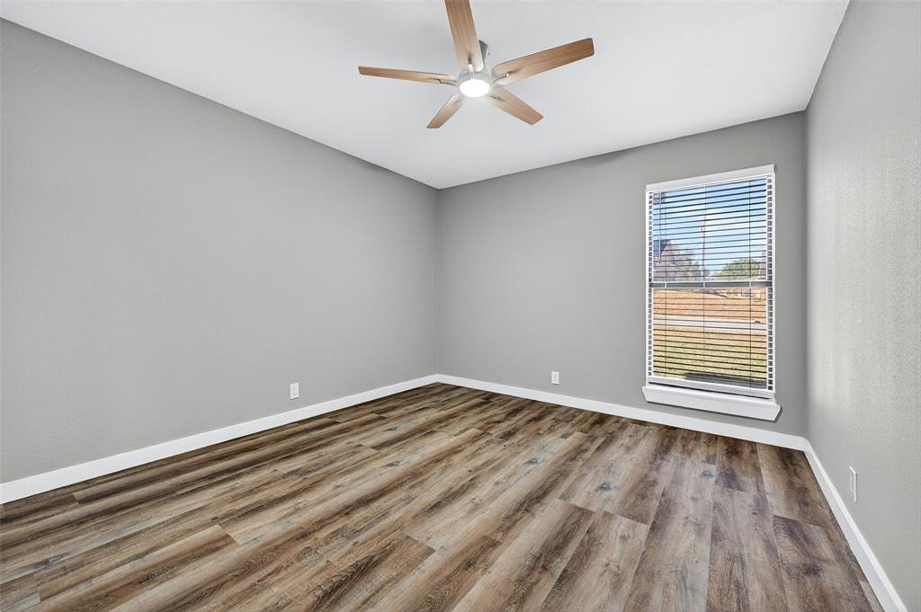 3014 Jennifer Avenue Denison, TX 75020 - Photo 16 of 23 wooden floor in an empty room with a window