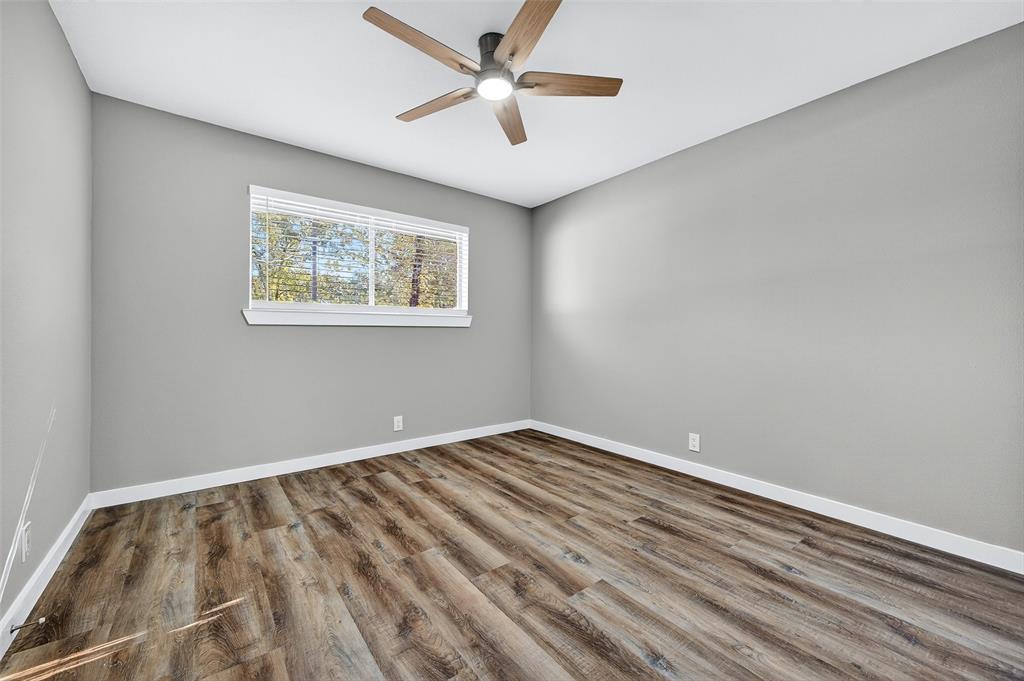 3014 Jennifer Avenue Denison, TX 75020 - Photo 18 of 23 an empty room with a window and a ceiling fan