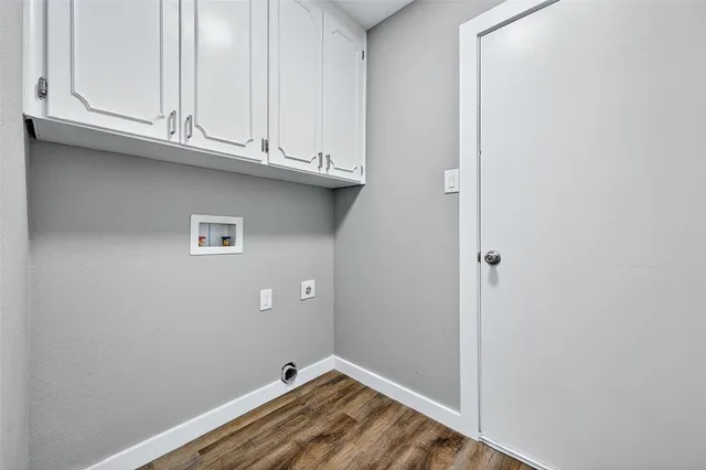 a view of a kitchen with granite countertop cabinets