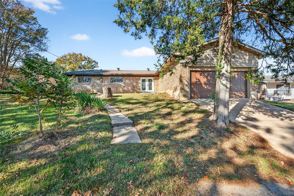 3014 Jennifer Avenue Denison, TX 75020 - Photo 23 of 23 a view of a house with a tree in a yard